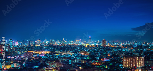 Aerial Panoramic Bangkok Cityscape Night View with Beautiful Skyline and Skyscraper Ratchada Business District Panorama View with Height Building at Blue Hour
