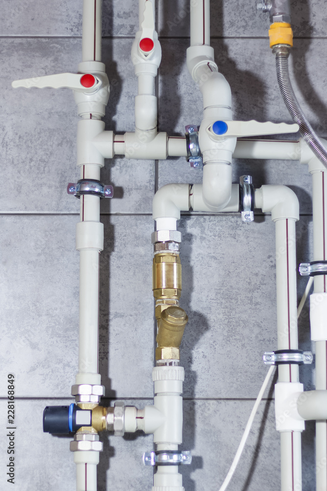 Heating system with plastic pipes, valves and other equipment in the boiler room Heating system with plastic pipes, valves and other equipment in the boiler room