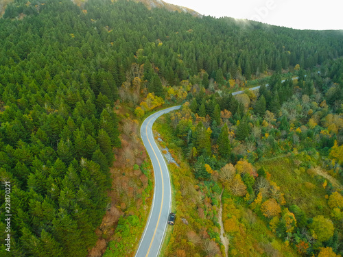 Aerial Drone Shot of Mountain Back road in Autumn / Fall foliage. Blue Ridge in the Appalachian Mountains near Asheville, North Carolina. Black Balsam Knob road 