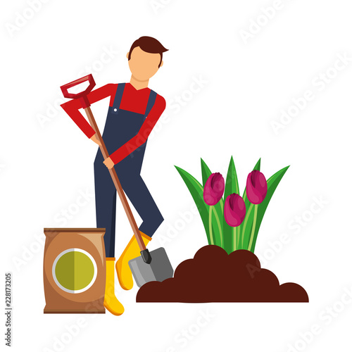 gardener man planting flower with sack soil and shovel