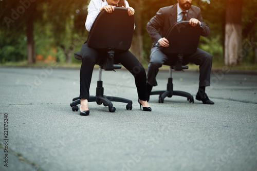 Race of office chairs. Business competition. Fight of genders concept. © Svyatoslav Lypynskyy