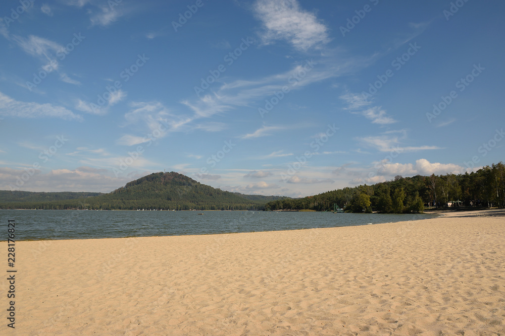 Machovo jezero lake with sandy beach and Borny hill on background in czech tourist area named Machuv kraj on 28th September 2018 Machovo jezero lake with sandy beach and Borny hill on background in czech tourist area named Machuv kraj on 28th September 2018