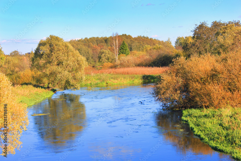 Autumn Nature with Colorful Trees and River VIew at Countryside Park. Autumn Scenery and Fall Seasonal Background with Green, Orange and Yellow Color Leaves. Outdoor Wallpaper of Autumn Landscape Autumn Nature with Colorful Trees and River VIew at Countryside Park. Autumn Scenery and Fall Seasonal Background with Green, Orange and Yellow Color Leaves. Outdoor Wallpaper of Autumn Landscape