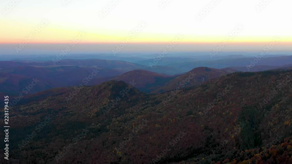 Aerial view. Mountain valley and orange larch forest woods in sunny autumn. Outdoor colorful nature landscape mountains wild fall. Autumnal forest small larch forest. Colors of fall. October forest. Aerial view. Mountain valley and orange larch forest woods in sunny autumn. Outdoor colorful nature landscape mountains wild fall. Autumnal forest small larch forest. Colors of fall. October forest.
