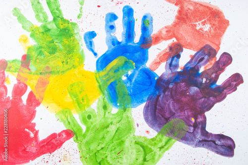 Foto Colorful hand paint from kids hands on white paper