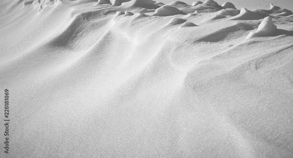Fototapeta premium Snowdrift after snowstorm or snowy weather with millions of brilliant shining dots on its surface, background, texture