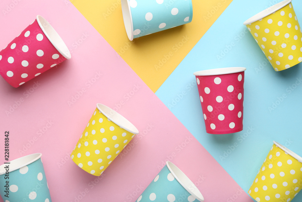 Paper cups on colorful background Paper cups on colorful background