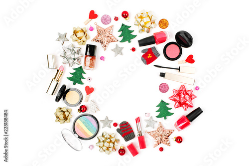 Christmas frame made from winter decorations and cosmetic products on white background. Holiday and celebration creative concept. Flat lay, top view