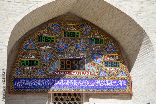 Islamic prayer times on display, Mausoleum of Bahouddin Nakshband, Bukhara, Uzbekistan. photo