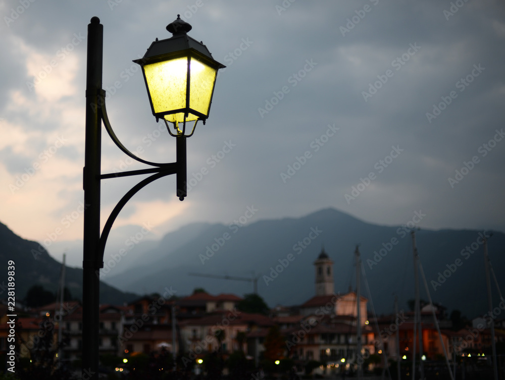 night view on the village of Feriolo at Lago Maggiore in Piemonte, Italy. Selective focus