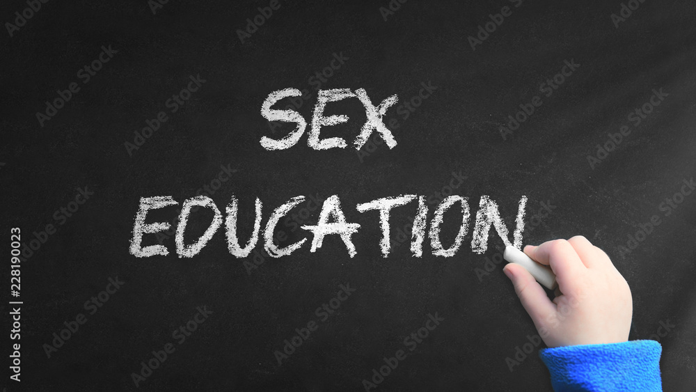 Fototapeta premium Sex education word written on a blackboard in a classroom during a sexual lecture at school. Empty copy space for Editor's text.