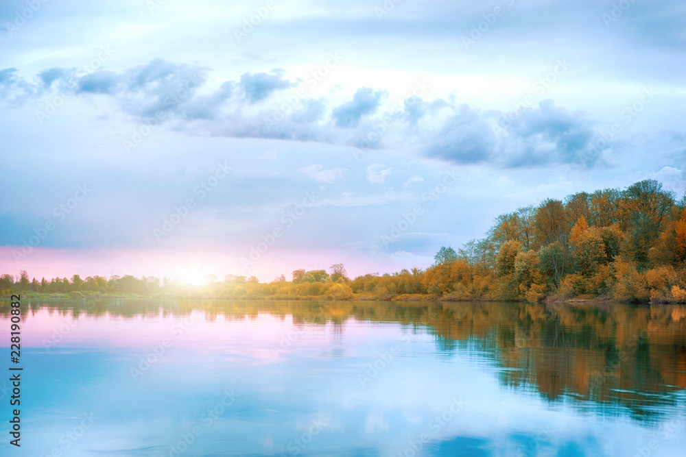 Fototapeta premium Symmetry reflection on the autumn river. Sunrise.