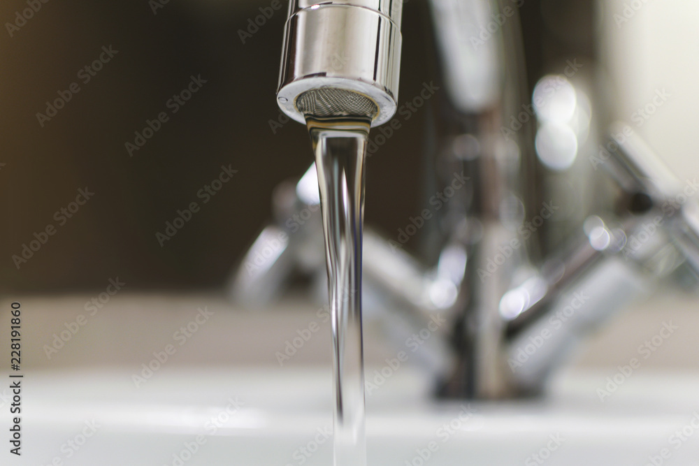 modern сhrome faucet with jet. closeup. modern сhrome faucet with jet. closeup.