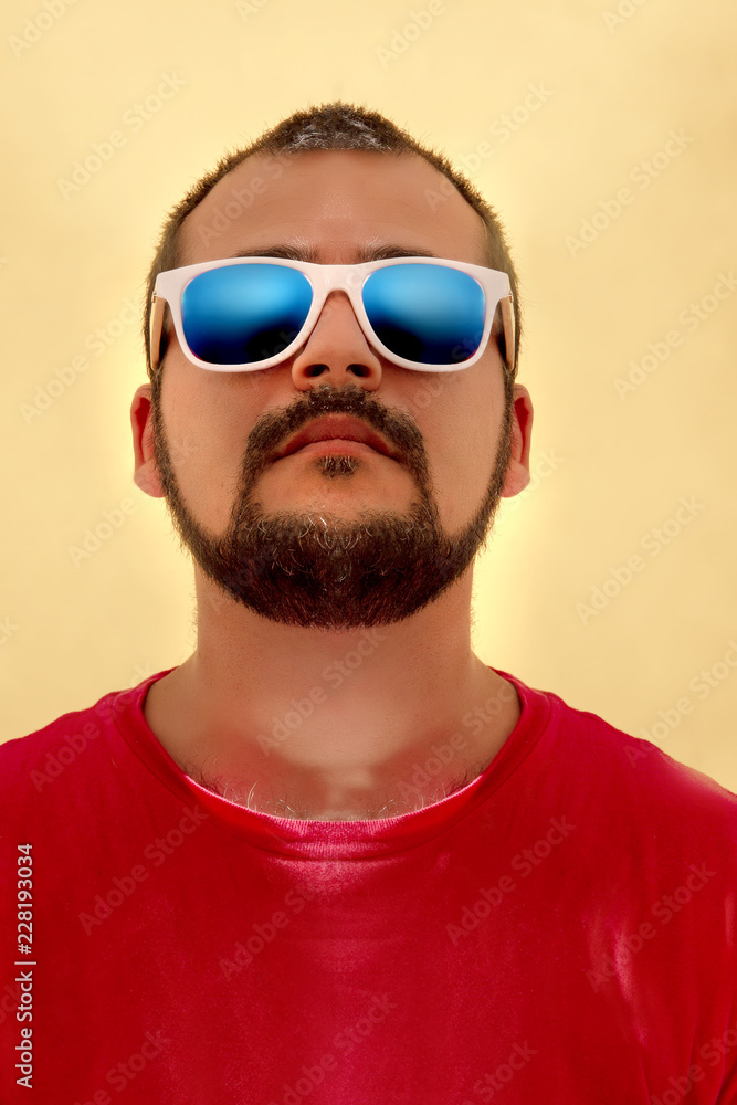 man with red shirt and sunglasses man with red shirt and sunglasses