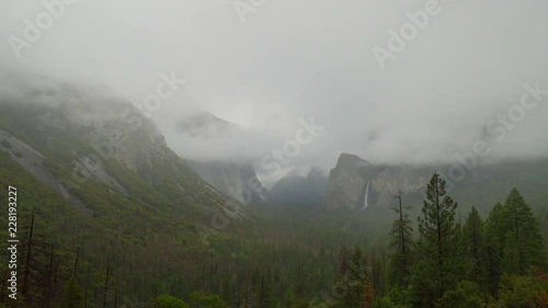 Tilt down to reveal Yosemite Valley from the Tunnel View on a cloudy day. 30p conformed to 24p. photo