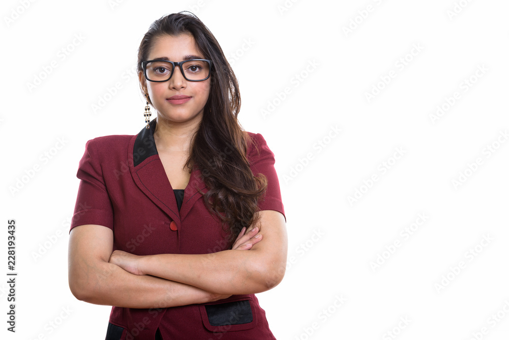 Young beautiful Indian businesswoman with arms crossed Young beautiful Indian businesswoman with arms crossed