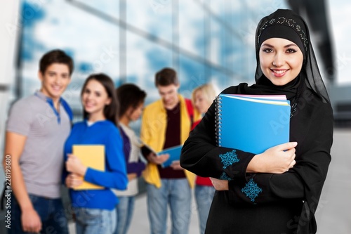 Close-up Beautiful Young Muslim Woman with notebooks,