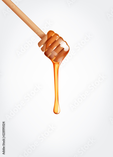 Honey flowing, dripping from wooden dipper stick.