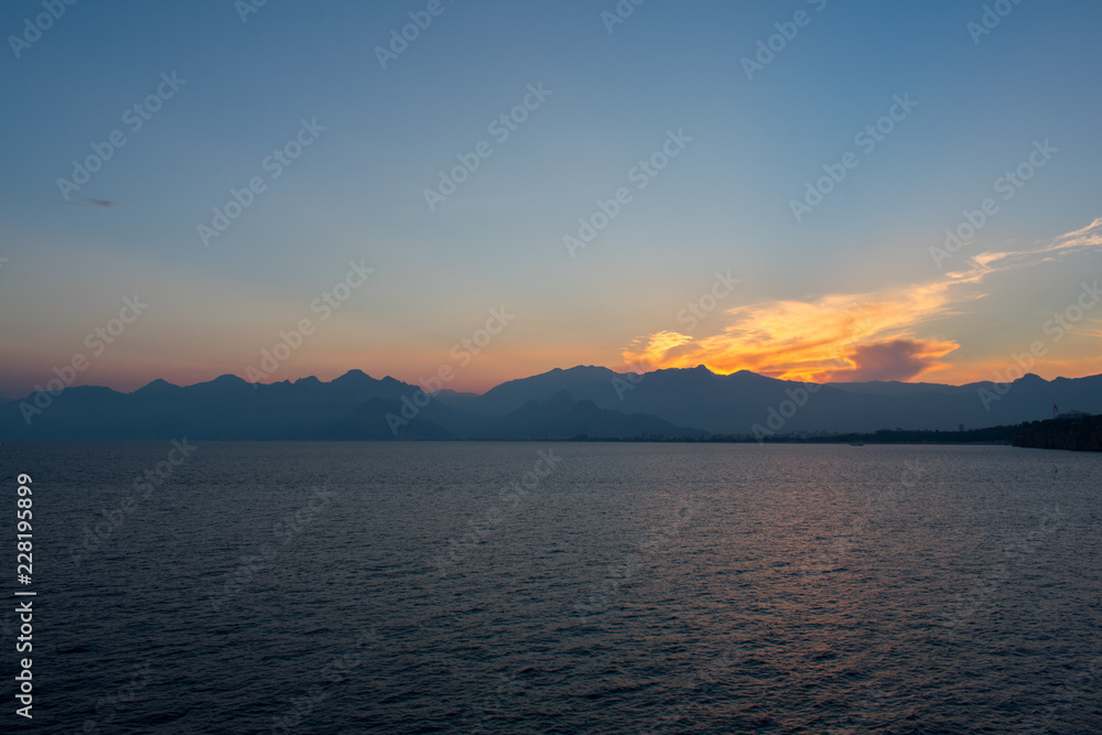 beautiful sunset above sea and taurus mountains in Antalya, Turkey