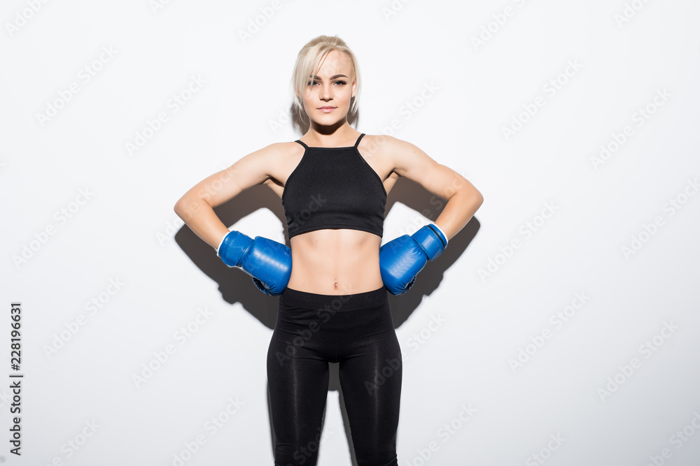 Young boxing Woman on white background. Boxer woman during boxing exercise. Girl training body combat. Woman boxer boxing isolated on white background