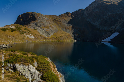 A view of Lake Okoto (The Eye) one of a group of glacial lakes in the northwestern Rila Mountains in Bulgaria. Autumn 2018 photo