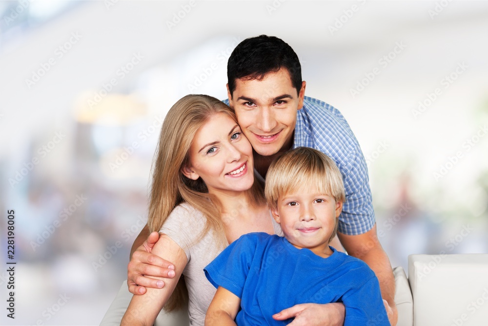 Happy family with son looking at camera