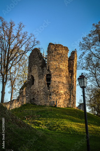 Beautiful afternoon light in public park with green grass and old medieval castle ruins. Shot in Cesis, Latvia.