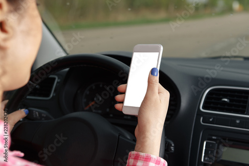 mobile phone with blank screen in car windshield holder © burdun