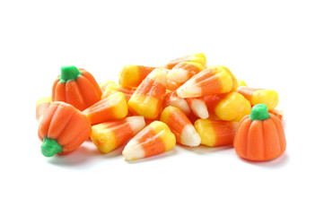 Colorful candy corns for Halloween party on white background