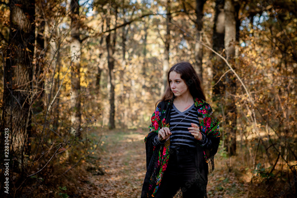 Halloween witch with a knife in the woods Halloween witch with a knife in the woods