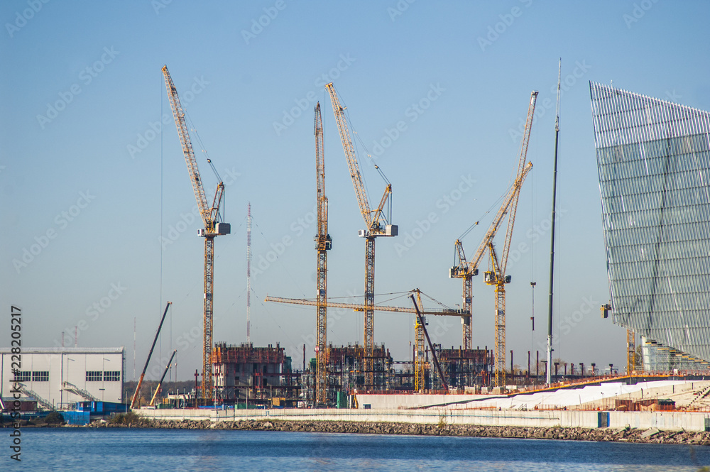 Fototapeta premium Hoisting cranes near the northern sea. Saint-Petersburg.