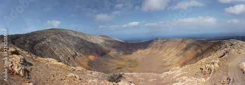 Panoramic view from the summit of a volcano crater in the island of Lanzarote, spain