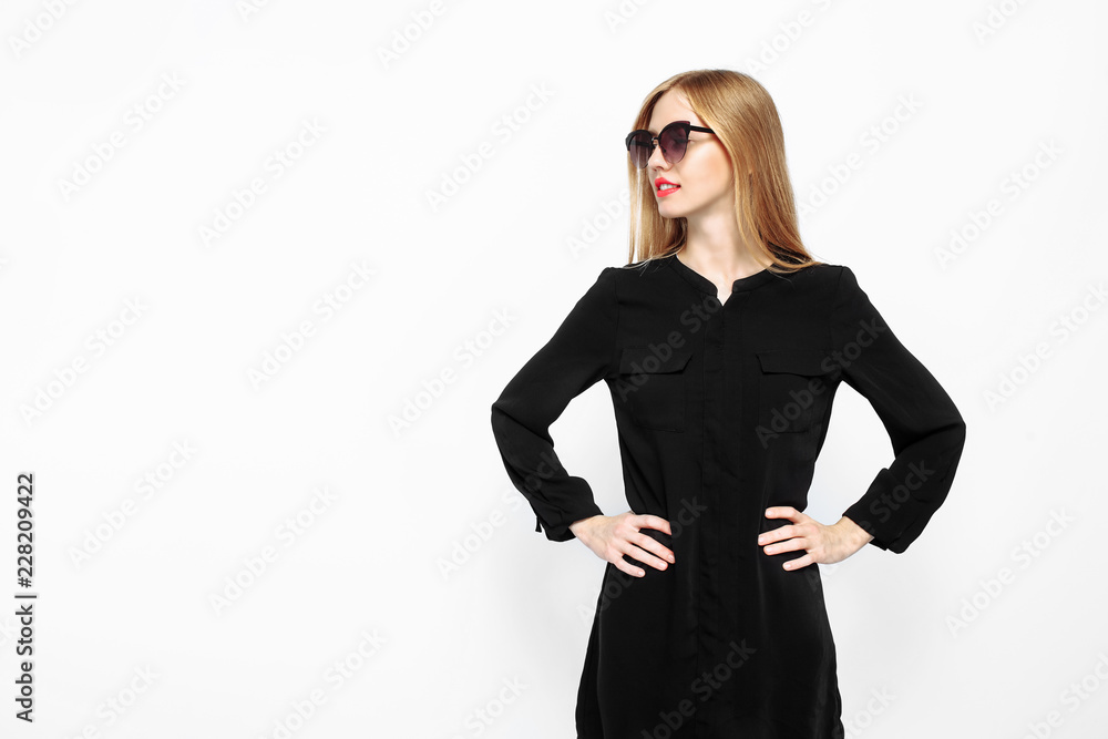 Elegant woman in sunglasses in black dress and with red lips, waiting For black Friday on white background Elegant woman in sunglasses in black dress and with red lips, waiting For black Friday on white background