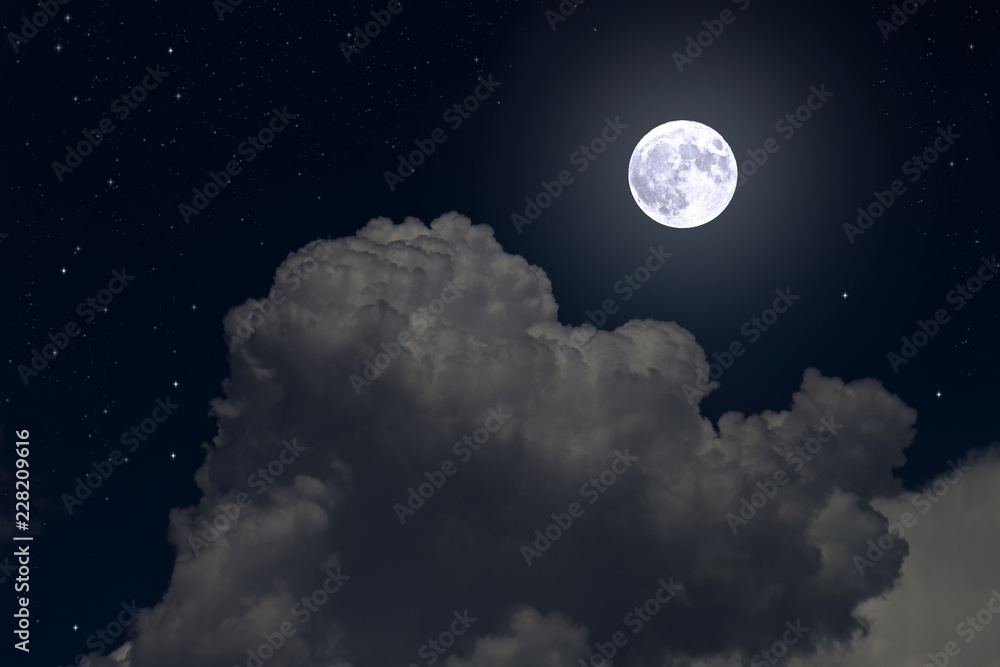 Full moon and stars in cumulus clouds