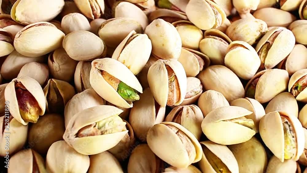 Pistachio texture. Nuts. Green fresh pistachios as texture. Roasted salted pistachio nuts healthy delicious food studio photo. Pistachio texture. Nuts. Green fresh pistachios as texture. Roasted salted pistachio nuts healthy delicious food studio photo.