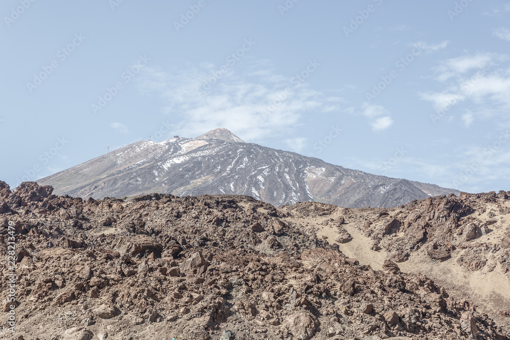Rocks and the Teide volcano in the background in the Teide National Park, Canary Islands