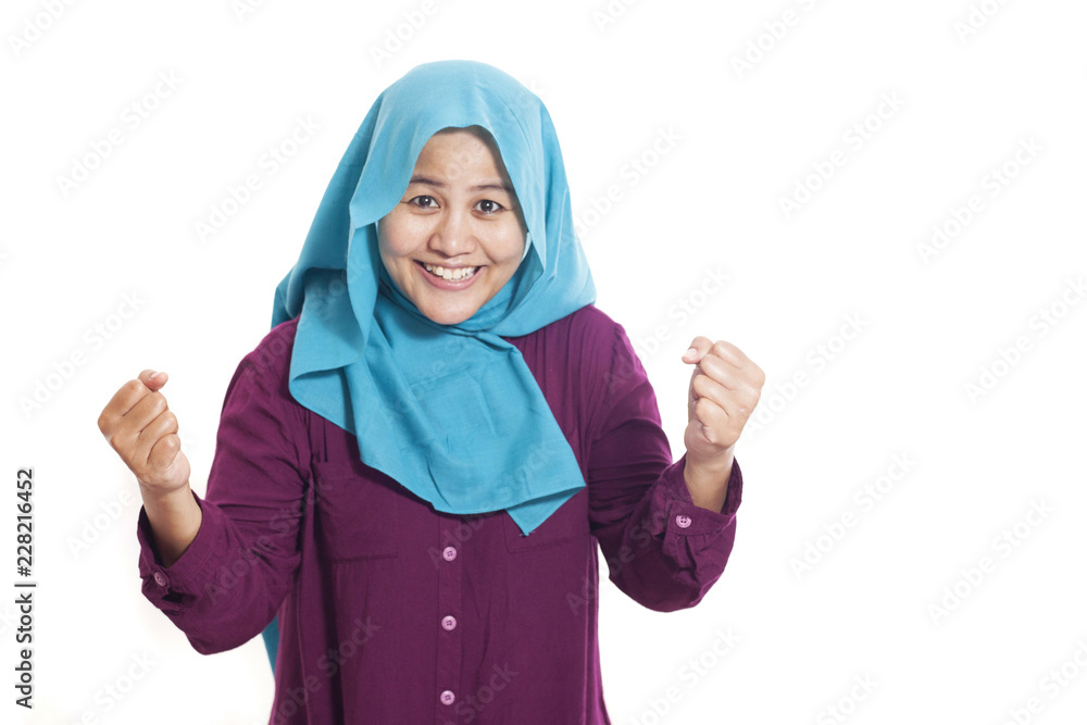 Muslim Lady Smiling with Winning Gesture Muslim Lady Smiling with Winning Gesture