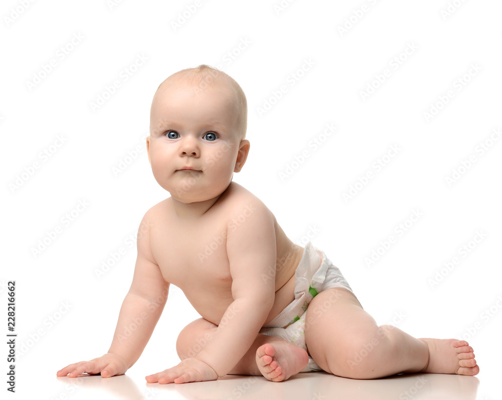 Infant child baby girl toddler crawling in diaper isolated on a white Infant child baby girl toddler crawling in diaper isolated on a white