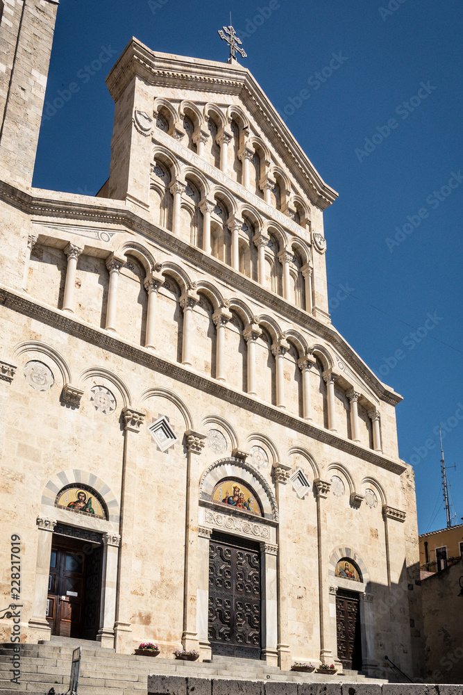 Exterior of La Cattedrale Santa Maria at Cagliari, Sardinia, Italy on a sunny day with blue sky. Located in downtown Cagliari, nobody in the scene.