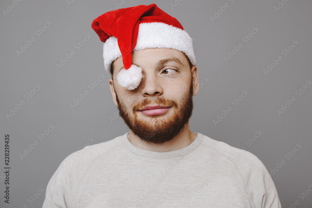 Man in Christmas hat looking away Man in Christmas hat looking away