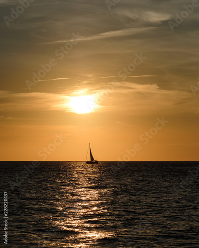 Sailboat silhouette at sunset on Cape May New Jersey © Jorge Moro