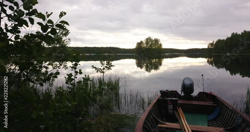 A smooth drone shot of a sunset by a boat photo