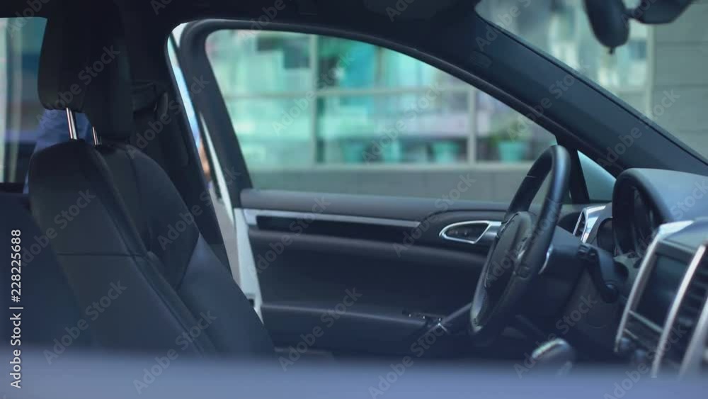 Respectable woman gets out of car parked near office center, busy lifestyle Respectable woman gets out of car parked near office center, busy lifestyle