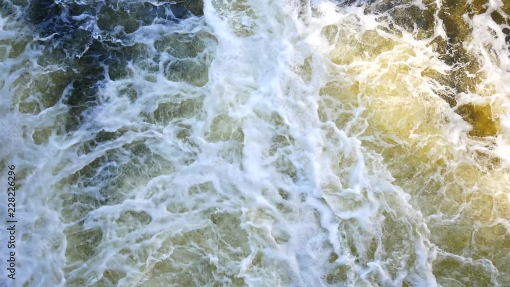 Turbulent streams of water in the sea or river. The power of nature, a fascinating background. Turbulent streams of water in the sea or river. The power of nature, a fascinating background.