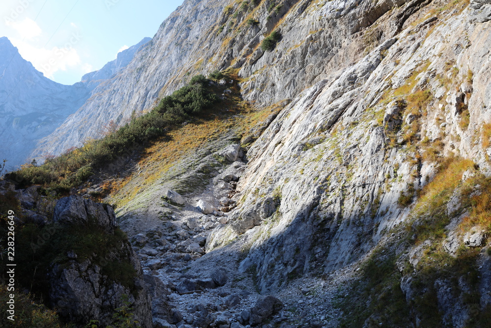 Mountain rocks with green cover in autumn in Höllental in German Alps Mountain rocks with green cover in autumn in Höllental in German Alps