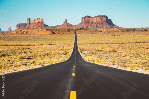 Classic highway view in Monument Valley at sunset, USA