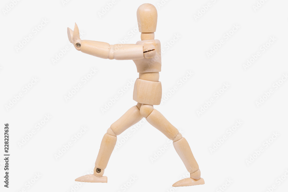 Wooden figure making stop gesture with her hand Wooden figure making stop gesture with her hand