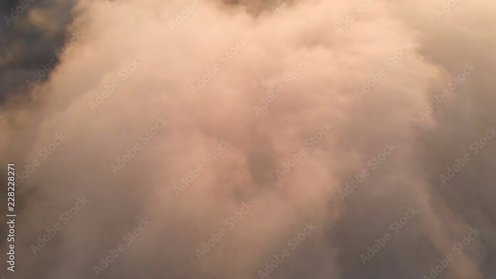 Real Flying over the evening timelapse clouds with the late sun. Flight through moving cloudscape with beautiful sun rays. Traveling by air. Perfect for cinema background Real Flying over the evening timelapse clouds with the late sun. Flight through moving cloudscape with beautiful sun rays. Traveling by air. Perfect for cinema background