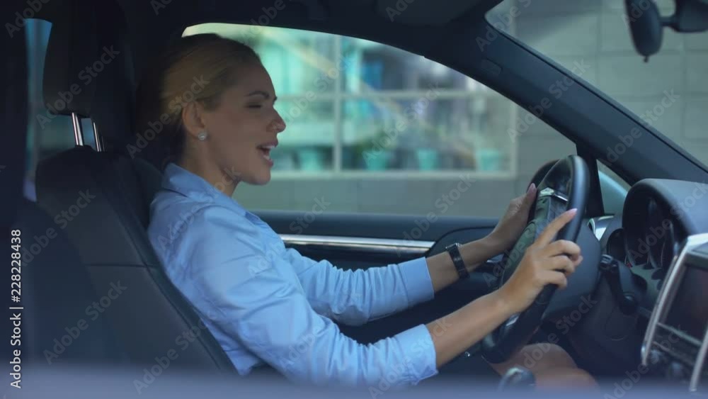 Lady driving car and singing loudly, enjoying successful happy life, positive Lady driving car and singing loudly, enjoying successful happy life, positive