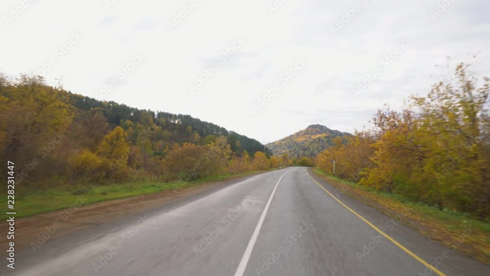 Beautiful mountain road. Movement of the camera. Blue sky and clouds. Beautiful mountain road. Movement of the camera. Blue sky and clouds.